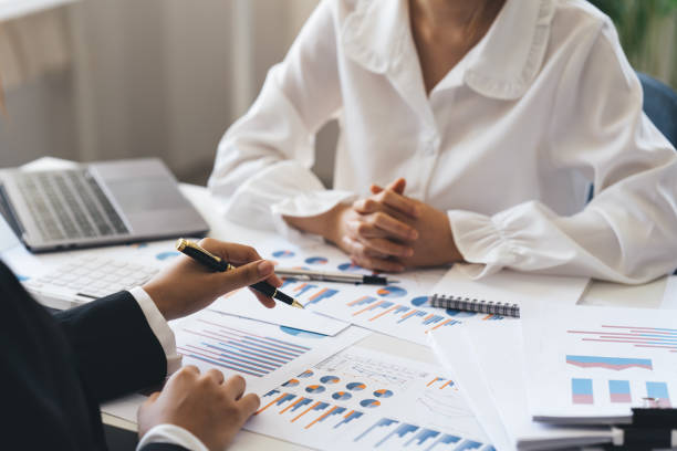 istock Young business team working with new startup project. discussing the charts and graphs showing the results at meeting. Business accounting and financial concept. 1389602601