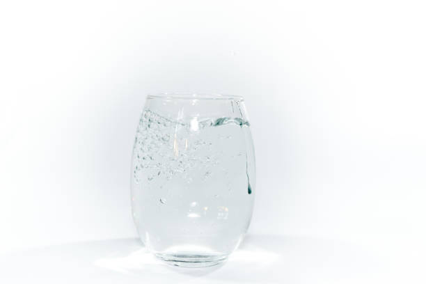 istock hand offering a glass of pure water 1389603393