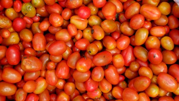 istock Stacked tomatoes cherry in traditional market, tomatoes cherry background 1389603429