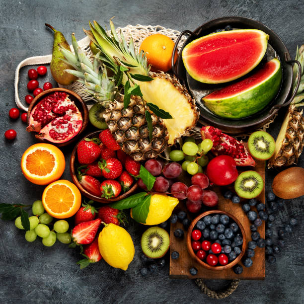 istock Delicious raw fruit on dark background. 1389607558