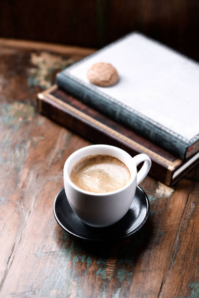 istock Cup of coffee on rustic wooden background. Close up. 1389613368