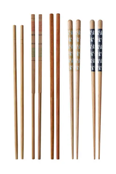 Wooden chopsticks for Japanese and Chinese isolated on white background. with clipping path included.
