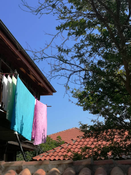 istock Washed bed linen flies on a sunny day 1389617589