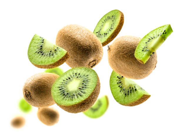 Kiwi fruit levitating on a white background stock photo