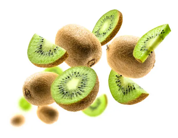 Kiwi fruit levitating on a white background.