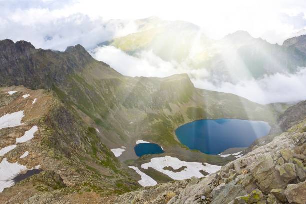 istock mountain valley in a rays of sun 1389621280