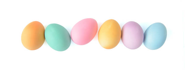 istock Easter eggs in a row isolated on white background, top view 1389622220