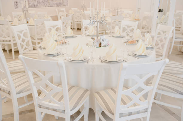 istock Close up arranged table with plates and glasses on a wedding 1389622956