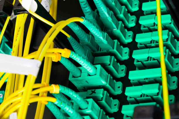 istock Fiber Optic cables connected to an optic ports 1389626549