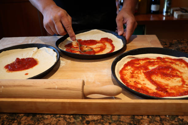Bake original Italian pizza at home. Traditional preparation. Bake original Italian pizza at home - Traditional preparation. pizza topping stock pictures, royalty-free photos & images