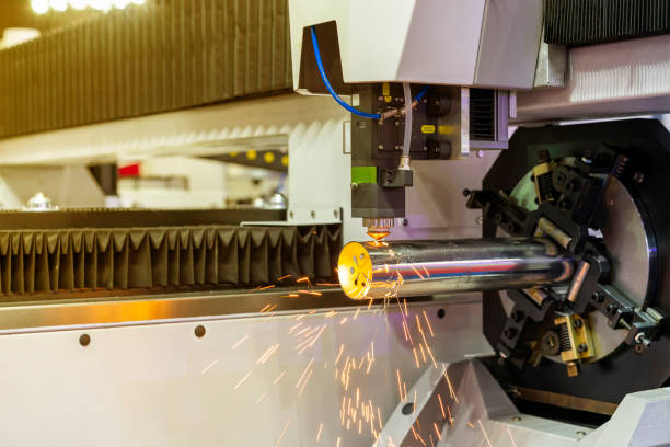 istock automatic feed rotate and clamp for pipe during working with high precision and accuracy cnc plasma laser cutting machine in manufacturing process 1389626846