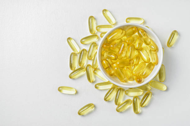 istock Flat lay(Top view) of Fish oil on white background view. 1389628495