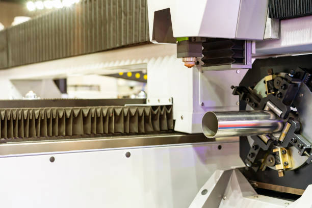 istock close up pipe product prepare setting by clamp of automatic feed and rotate unit high precision & accuracy cnc plasma laser cutting machine for engrave or perforate 1389628782