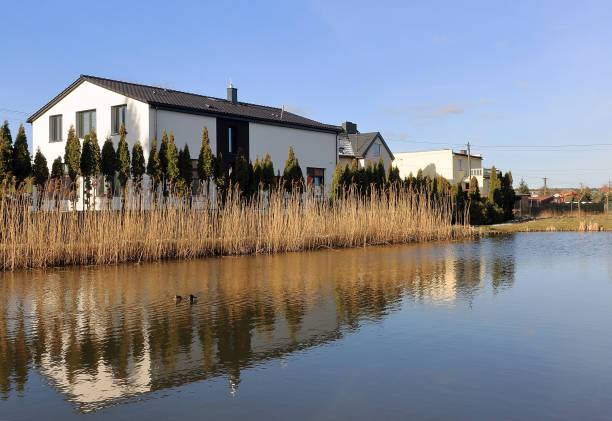 The building reflected in the surface of the water somewhere in Poland