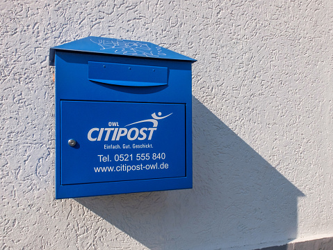 Bielefeld, Germany: 24 March 2022: The letterbox of the CITIPOST company in Germany on the wall of a house.