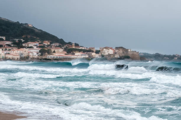 Rough sea at Algajola in Corsica stock photo