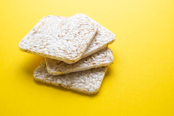 istock Rice cake on a yellow background close-up 1389631629