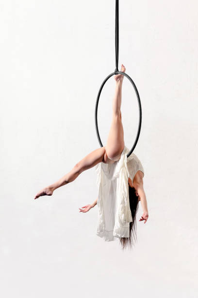 istock Woman performing trick on aerial hoop 1389632886