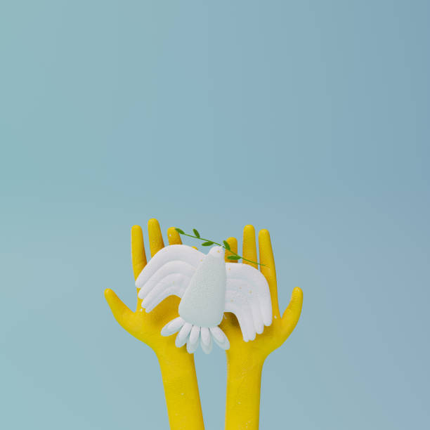 istock 3d render, 3d illustration. White bird dove of peace on yellow hands. 1389637235