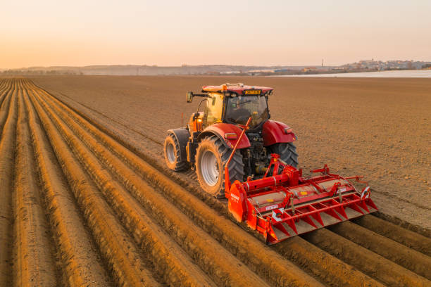 a tractor working over farmland