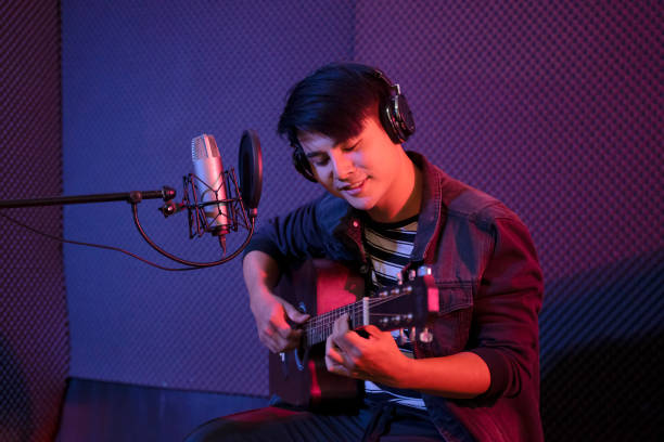leisure activity of young musician. sing a song in studio. - chinese ethnicity audio imagens e fotografias de stock