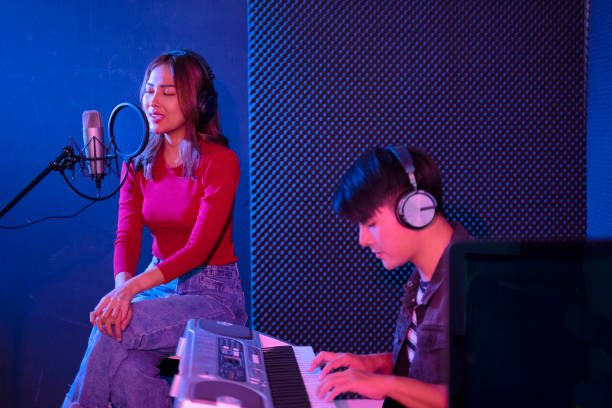 istock Leisure activity of young musician. Sing a song in studio. 1389640158