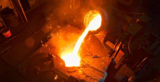 istock Pouring molten steel in cast 1389640440