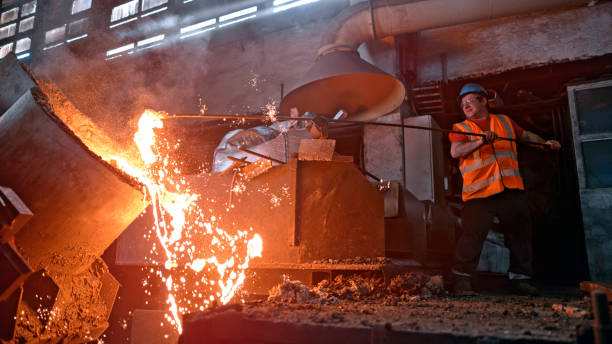 istock Man melting metal in foundry 1389640482