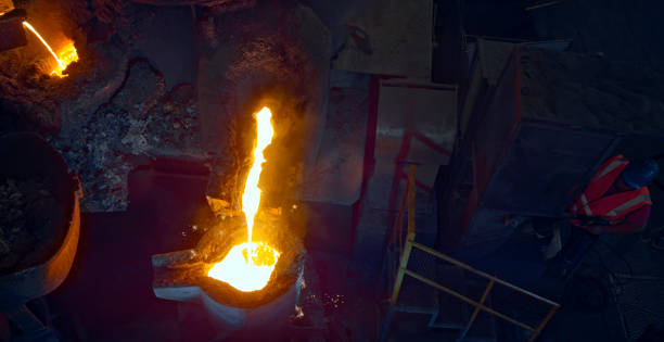 Molten steel pouring into a cast in steel mill.