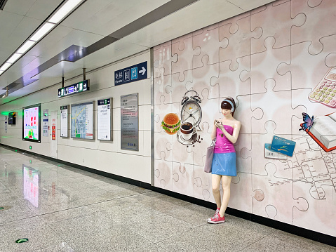 October 23, 2021: Beijing Subway Line 10 CAOQIAO Station Hall,  The clean and tidy hall is beautifully decorated. There are nearby maps, road signs, guidance, information tips, etc.