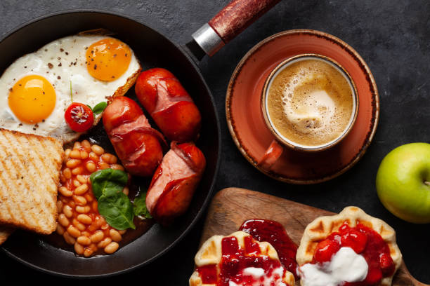 istock English breakfast with fried eggs, beans, bacon and sausages 1389642661