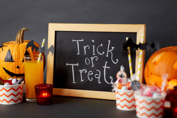 istock pumpkins, candies and halloween decorations 1389642940