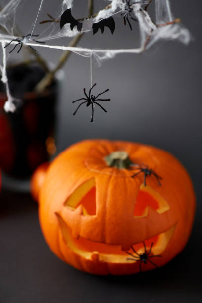 istock pumpkins, candles and halloween decorations 1389643136