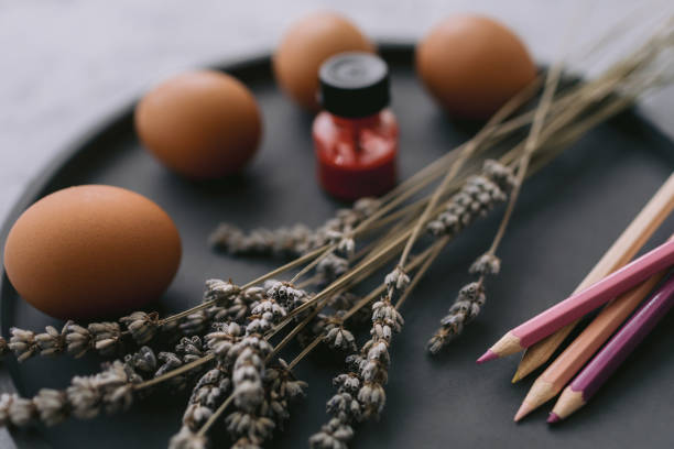 istock Multicolour paints and brushes on the plate with eggs. 1389643151