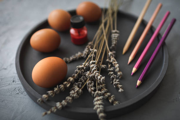 istock Multicolour paints and brushes on the plate with eggs. 1389643823