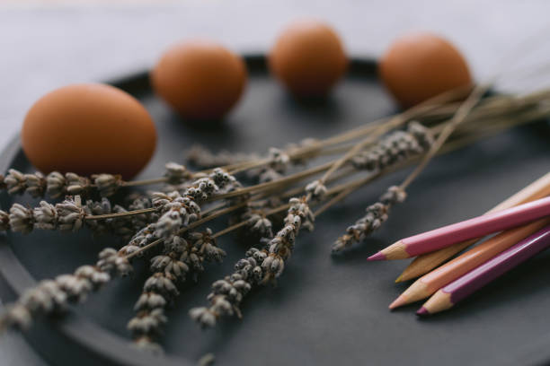 istock Multicolour paints and brushes on the plate with eggs. 1389643893