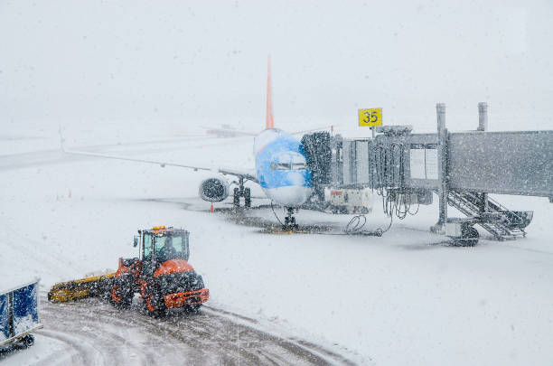 istock Snow plow removing snow in airport 1389644098