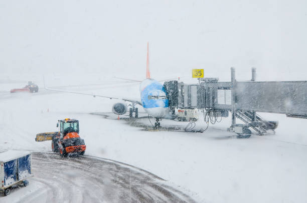istock Snow plow removing snow in airport 1389644127