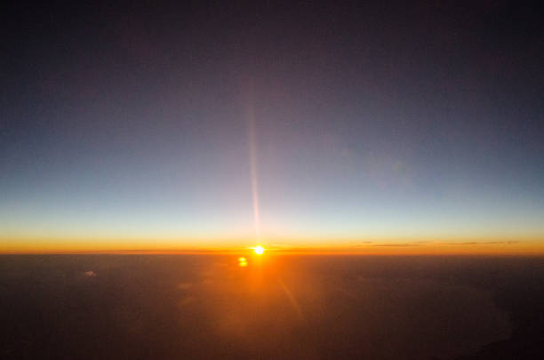 istock Sunset viewed from airplane porthole 1389644306