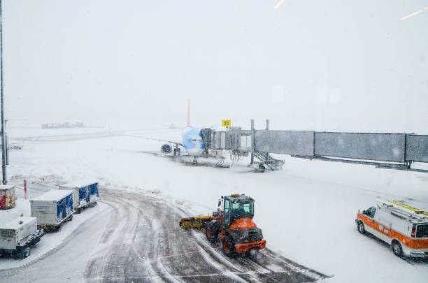 istock Snow plow removing snow in airport 1389645499