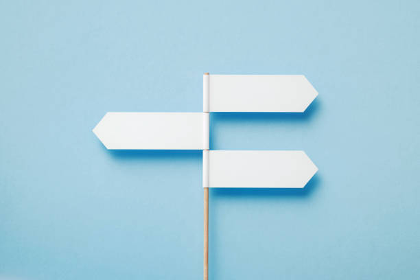 three directional signs pointing opposite directions over blue background - directional sign road sign blank arrow sign imagens e fotografias de stock