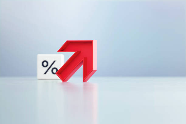 istock Red Up Arrow And Percentage Sign Written White Cube Sitting Before Defocused  Background 1389647073