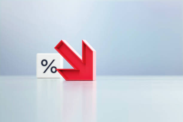 istock Red Down Arrow And Percentage Sign Written White Cube Sitting Before Defocused  Background 1389647120
