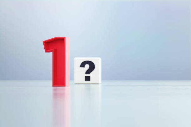 istock Red Number 1 And Question Mark Written White Cube Sitting Before Defocused  Background 1389647167