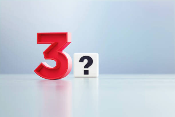 istock Red Number 3 And Question Mark Written White Cube Sitting Before Defocused  Background 1389647389