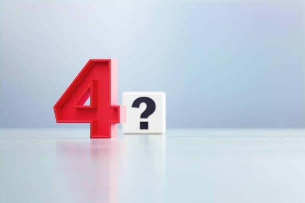 istock Red Number 4 And Question Mark Written White Cube Sitting Before Defocused  Background 1389647425