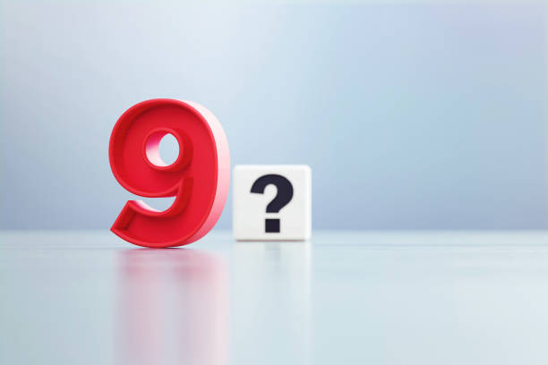 istock Red Number 9 And Question Mark Written White Cube Sitting Before Defocused  Background 1389647477