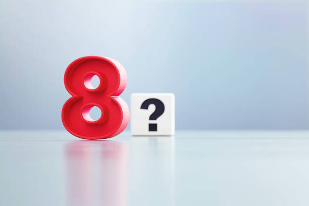 istock Red Number 8 And Question Mark Written White Cube Sitting Before Defocused  Background 1389647524