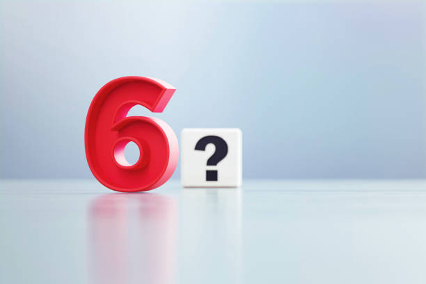 istock Red Number 6 And Question Mark Written White Cube Sitting Before Defocused  Background 1389647753