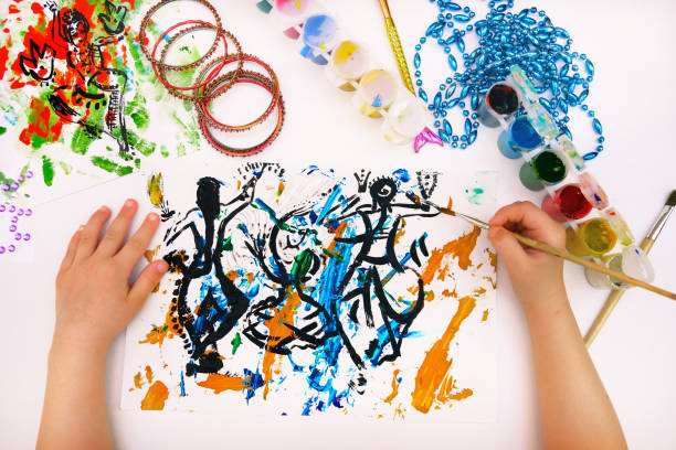 Child creativity. Painting with mixed media with abstract lines paints